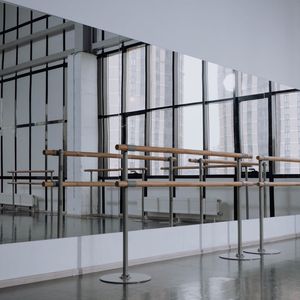 Empty, bright room with natural light, representing a clear space for practice.